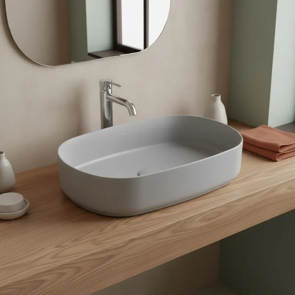 Lavabo d'appoggio ovale senza foro BathCore série Infinity 55x36 couleur Gris Pierre Mat